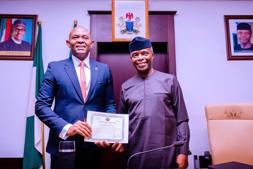 Vice Yemi Osinbajo presents discharge certificate to Transcorp