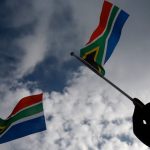 Newly sworn-in South African MP suspended over racist language
