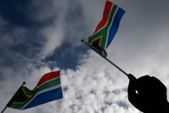 Newly sworn-in South African MP suspended over racist language