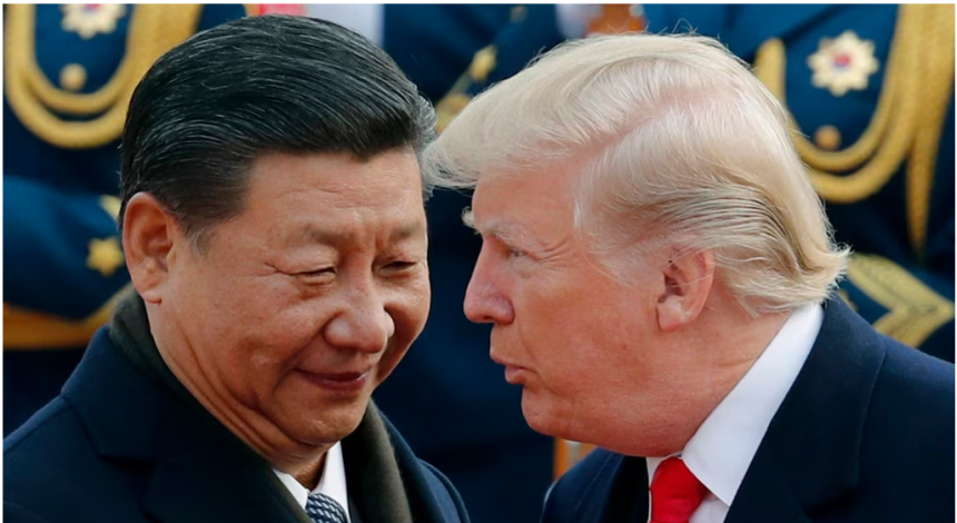 US President Donald Trump chats with Chinese President Xi Jinping during a welcome ceremony at the Great Hall of the People in Beijing on Nov. 9, 2017.