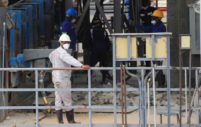Workers work at Prospect Lithium Zimbabwe mine in Goromonzi, Zimbabwe, January 9, 2024.